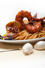 Image showing Italian seafood spaghetti pasta on red tomato sauce 