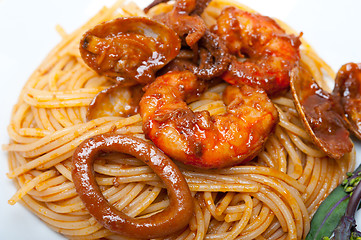 Image showing Italian seafood spaghetti pasta on red tomato sauce 