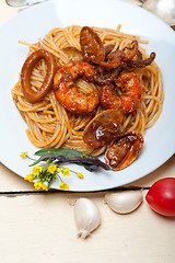 Image showing Italian seafood spaghetti pasta on red tomato sauce 