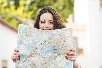 Image showing Beautiful tourist searching on the map