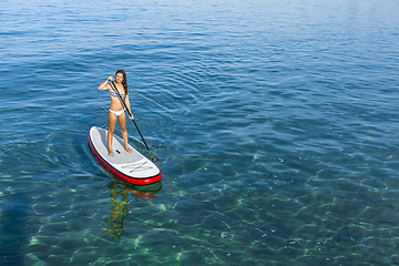 Image showing Woman practicing paddle