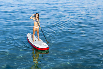 Image showing Woman practicing paddle