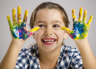 Image showing Little girl with hands in paint