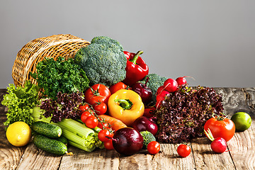 Image showing The vegetables from a  basket on wooden table