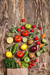 Image showing The vegetables from a paper bag on wooden table