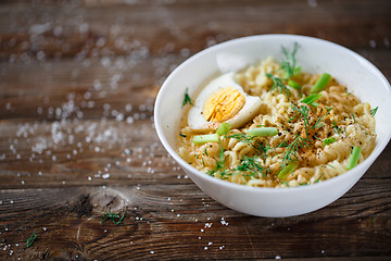 Image showing Asian noodles with fresh green onion and boiled egg