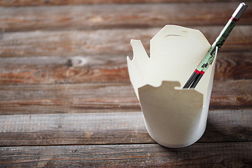 Image showing Blank Chinese food container on old wood table