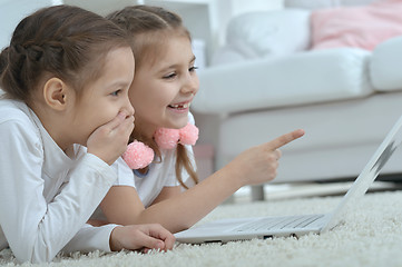 Image showing little girls looking at laptop