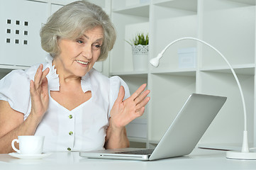 Image showing Elderly woman working on laptop