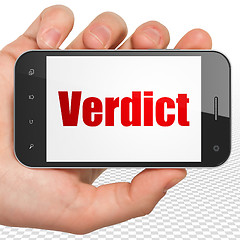 Image showing Law concept: Hand Holding Smartphone with Verdict on display