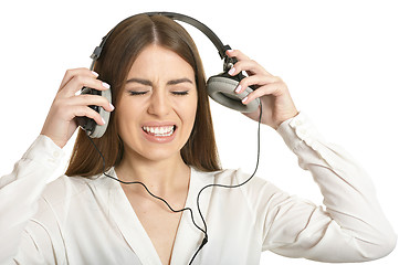 Image showing Girl listening  music in headphones.