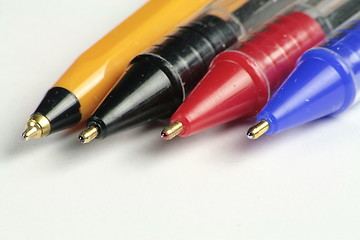 Image showing four different coloured ball point pens
