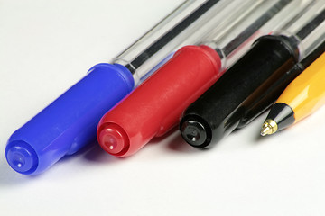 Image showing four different coloured ball point pens