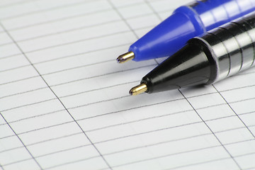 Image showing two pens on note paper