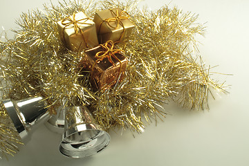 Image showing gold present box decorations with golden tinsel