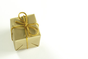 Image showing small present tied with gold string