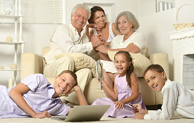 Image showing Happy family with kids with laptop