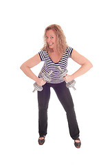 Image showing Woman lifting dumbbells for workout.