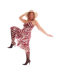 Image showing Woman dancing in dress and hat.