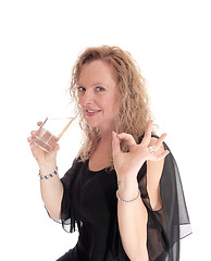 Image showing Blond woman drinking water.