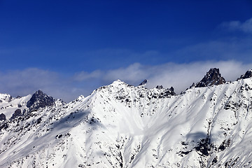 Image showing View on snowy mountains in haze at sunny day