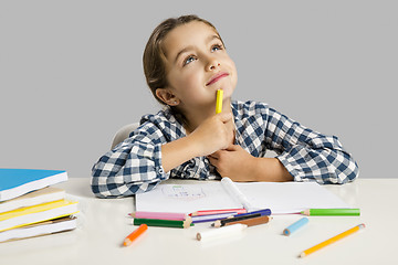 Image showing Little girl making drawings