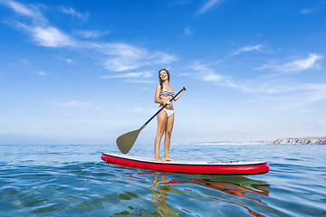 Image showing Woman practicing paddle