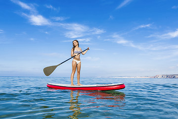 Image showing Woman practicing paddle