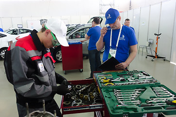 Image showing Young car mechanic passes competition stage.Tyumen