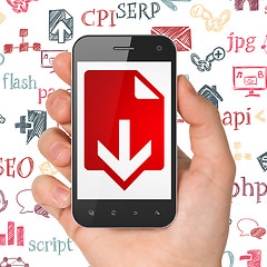 Image showing Web development concept: Hand Holding Smartphone with Download on display