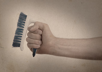 Image showing Cleaning brush in hand - Vintage