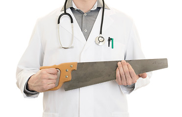 Image showing Crazy doctor is holding a big saw in his hands