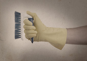 Image showing Cleaning brush in hand - Vintage