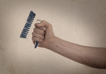 Image showing Cleaning brush in hand - Vintage