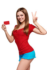 Image showing Smiling girl showing red card in hand