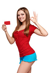 Image showing Smiling girl showing red card in hand