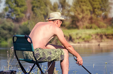 Image showing Fisherman on the river fishing.