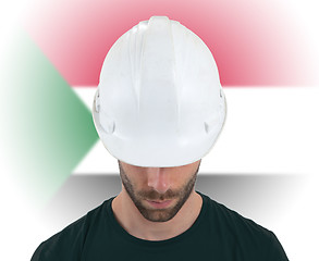 Image showing Engineer with flag on background - Sudan