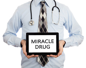 Image showing Doctor holding tablet - Miracle drug