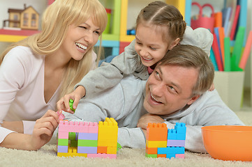 Image showing happy family playing at home