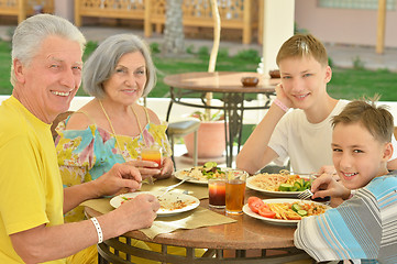 Image showing Grandparents with grandchildren at breakfast