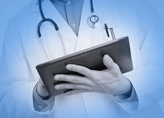 Image showing Doctor using a digital tablet, medical blue