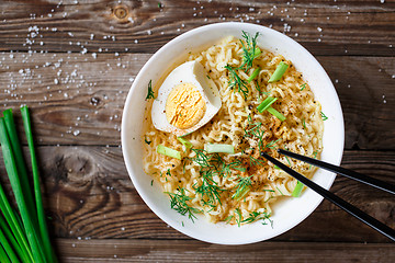 Image showing Asian noodles with fresh green onion and boiled egg