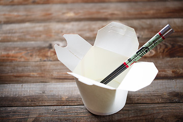 Image showing Blank Chinese food container on old wood table