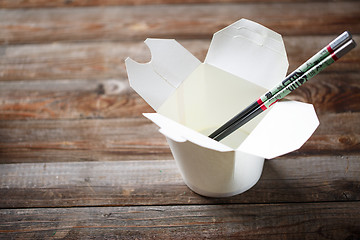 Image showing Blank Chinese food container on old wood table