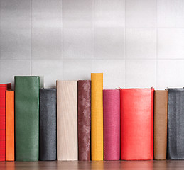 Image showing stack of books on the shelf