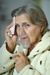 Image showing woman with inhaler