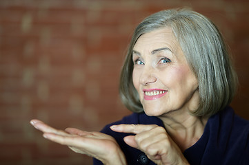 Image showing Older woman pointing