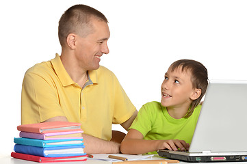 Image showing Father is helping his son