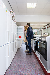 Image showing Couple Buying Refrigerator In Hypermarket